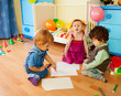 Tree kids drawing sitting on the floor Tree kids drawing sitting on the floor