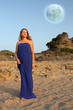 Beautiful young woman and full moon