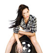 Sexy Woman Sitting On Car Tyre
