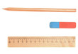 Eraser, pencil and ruler on a white background.