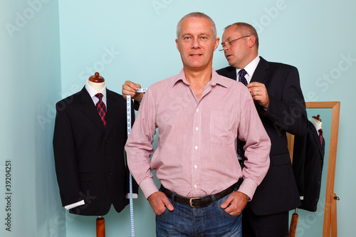 Photo: Man being fitted for a bespoke suit Man being fitted for a bespoke suit