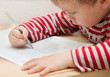 little boy learning to write
