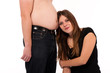 girl leaning against her boyfriends belly