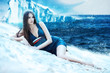 Woman in dress on the snowy beach and iceberg