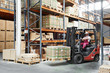 worker driver at warehouse forklift loader works