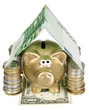 A golden moneybank under house made from banknote