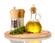 Oil in a bottle and fresh rosemaryon wooden board isolated
