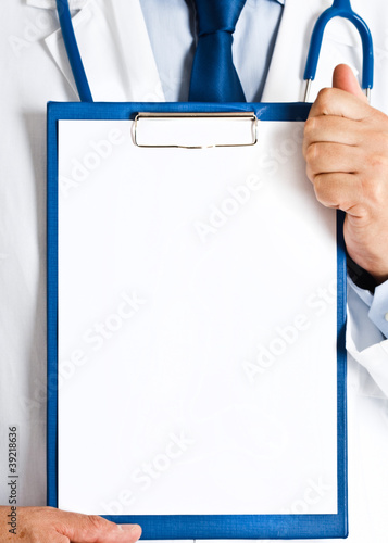 Photo: Doctor showing a blank sheet of paper Doctor showing a blank sheet of paper