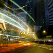 moving car with blur light through city at night