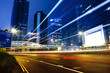 moving car with blur light through city at night