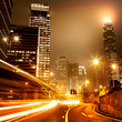 moving car with blur light through city at night