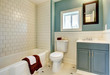 Photo: New remodeled blue bathroom with classic white tile. New remodeled blue bathroom with classic white tile.