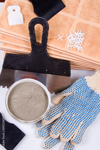 Photo: Ceramic tiles and trowel for repairs Ceramic tiles and trowel for repairs