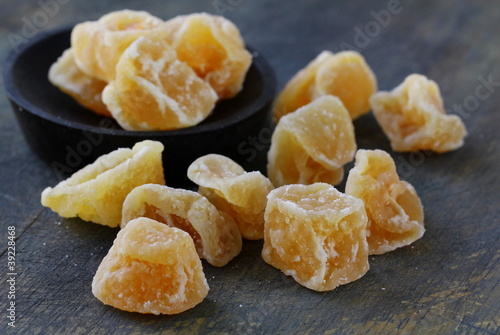 Photo: candied ginger on a dark background candied ginger on a dark background