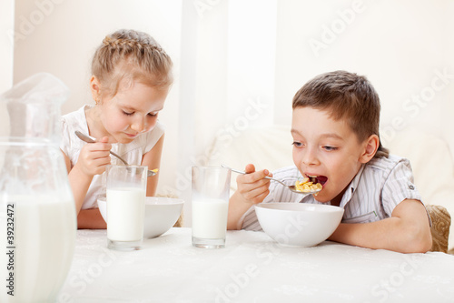 Photo: Children eat breakfast Children eat breakfast