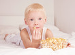child with popcorn