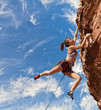 Rock climber dangling.