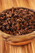 Anise stars in a wooden bowl Anise stars in a wooden bowl