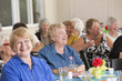 Senior women laughing at a luncheon