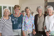 Portrait of senior female friends smiling at a lunch