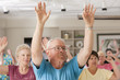 Seniors exercising in a health club