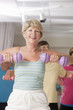 Senior exercise class working with dumbbells