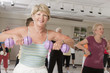 Senior exercise class working with dumbbells