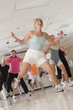 Senior exercise class doing stretches and cardio
