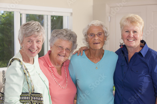 Photo: Portrait of four senior female friends smiling together Portrait of four senior female friends smiling together