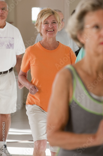 Photo: Seniors exercising in a health club Seniors exercising in a health club