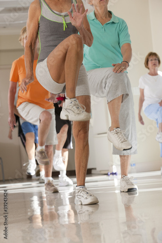 Photo: Seniors exercising in a health club Seniors exercising in a health club