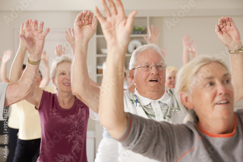 Photo: Seniors exercising in a health club Seniors exercising in a health club