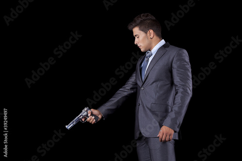 Photo: Businessman aiming a handgun Businessman aiming a handgun