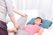 young japanese woman getting chiropractic