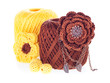 Cotton yarn with brooch, knitted flower on white background