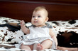 baby in white dress