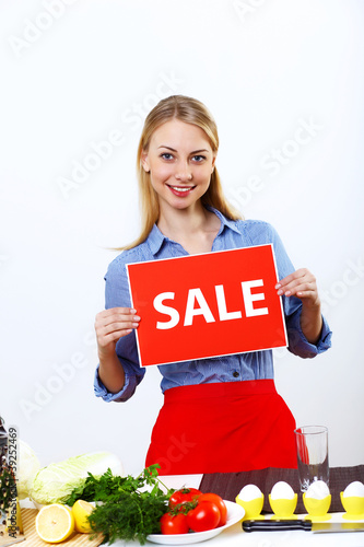 Photo: Woman cooking fresh meal at home Woman cooking fresh meal at home