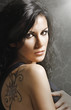 Foto: Woman with tatoo Woman with tatoo