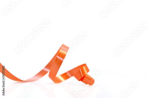 Photo: Orange ribbon on white background Orange ribbon on white background