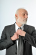 a man fixes his tie