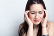 Headache concept - woman suffering a migraine