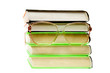 Stack of books with glasses isolated