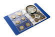 Album for coins and magnifying glass