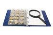 Album for coins and magnifying glass