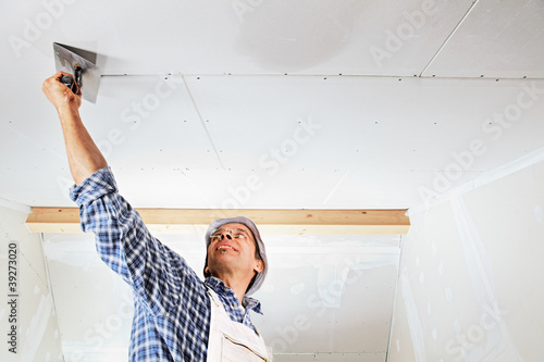 Photo: studwork: filling the joints of the plaster boards studwork: filling the joints of the plaster boards