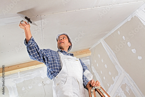 Photo: studwork: filling the joints of the plaster boards studwork: filling the joints of the plaster boards