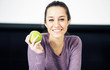 portrait of a beautiful young woman with green apple