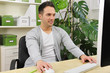 Photo: green office: businessman working green office: businessman working
