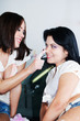 Two girlfriends caress each other in a soapsuds