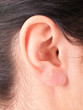 Close-up woman's ear